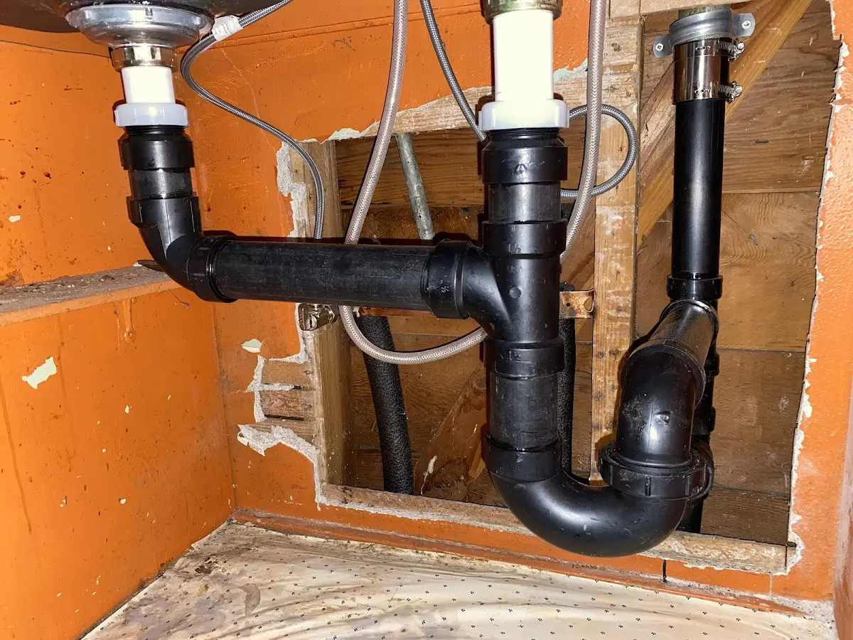 Professional Garbage Disposal Repair equipment and tools on the job in Fargo